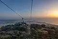 Gondola of the Trapani–Erice Cable Car at sunset, with the province of Trapani in the background
