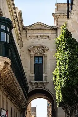 Extended gallarija used architecturally in conjunction with an archway on Old Theatre Street, Valletta