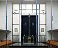 Interior of the synagogue with the Bimah and the Holy Ark in the back