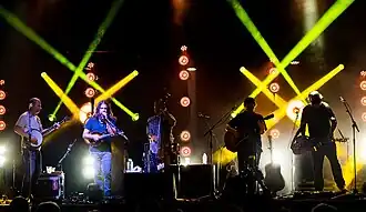 From left to right: Michael Bont (banjo/vocals), Paul Hoffman (mandolin/vocals), Mike Devol (bass/vocals), David Bruzza (guitar/vocals), Anders Beck (dobro).
