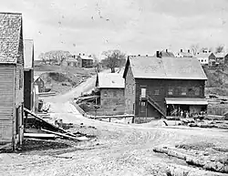 A 19th-century westerly view of one of the former grist mills (right) on the site of today's park
