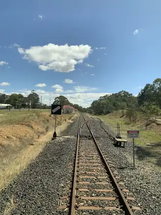 The Gwabegar railway line through Clandulla, with Clandulla station on the left
