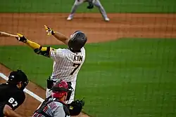 Ha-seong Kim swinging (from behind) in 2021