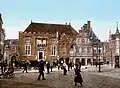 In this photograph from c.1900 the tower is gone, the stairs have their railing, the balcony is gone, and on the right a large clock can be seen that served until after WWII.