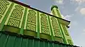 Arched carvings on the side of the mosque building.