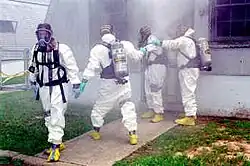 DEA agents wearing Level B hazmat suits