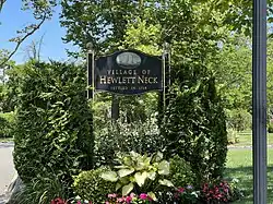 A Hewlett Neck village welcome sign in 2022