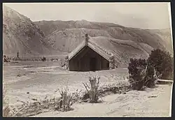 Hinemihi Meeting House at Te Wairoa immediately after the 1886 eruption of Mount Tarawera.
