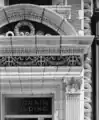 A detail of the ornate terra cotta decoration adorning the building's entrance