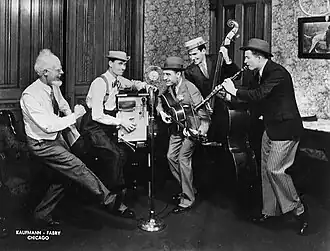 The Hoosier Hot Shots with Uncle Ezra (announcer Pat Barnett, at left) publicity photo for the National Barn Dance, 1935