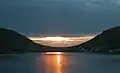 Sunset in Hvalba, seen from the sea.