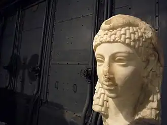 Possible sculpted head of Cleopatra VII wearing an Egyptian-style vulture headdress, discovered in Rome, either Roman or Hellenistic Egyptian art, Parian marble, 1st century BC, from the Capitoline Museums[441][442]