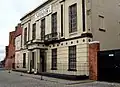 2 Islington Square, warehouse later used as a music academy (c.1830; Grade II)