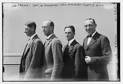 Gill standing in profile together with three of his polo teammates in 1922