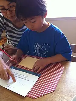 Japanese Mom teaching her Child to read