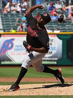 A baseball player in black and gray