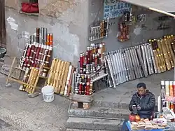 A vendor of tobacco and traditional Yunnan smoking pipes in Jianshui, Yunnan, China