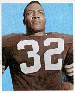 Jim Brown, wearing a jacket, poses for a picture.