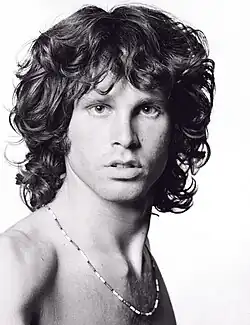 Photograph of Jim Morrison looking into the camera