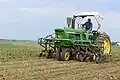 4020 narrow front with cultivator attachment