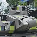 View of the 12.7 mm coaxial machine gun, gunner's sight and commander's sight
