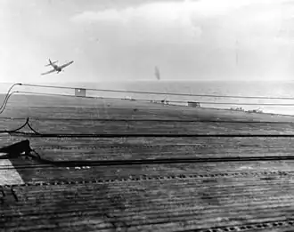 Tokkotai unit Kamikaze crash diving, about to miss escort carrier USS White Plains (CVE‑66), 25 October 1944