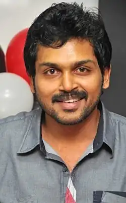 Smiling man in a grey shirt