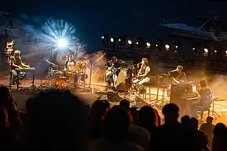 King Gizzard & the Lizard Wizard performing in Detroit in 2024. Left to Right: Cook Craig, Michael Cavanagh, Lucas Harwood, Stu Mackenzie, Joey Walker, and Ambrose Kenny-Smith.