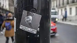 Photo of a sticker on a lamp post