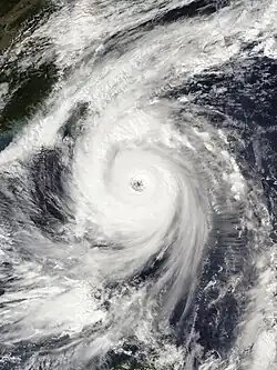 Satellite image of Typhoon Kong-rey with a clearly visible eye and large rainbands spiraling around it.