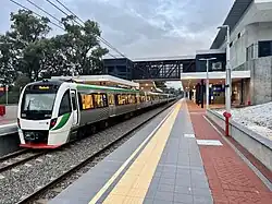 Electric passenger train on railway tracks