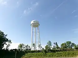 The Lamont water tower as seen from US Routes 19 and 27 in April 2024.
