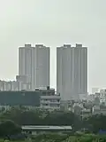 A residential high-rise building complex with two towers.