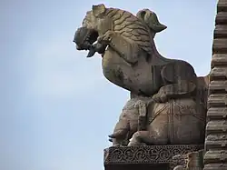 A sculpted griffin or "udagajasingha" on the main temple spire.