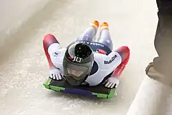 Yarnold competing on her sled