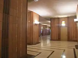 View of the lobby's two perpendicular bends. The lobby turns left and then immediately turns right.