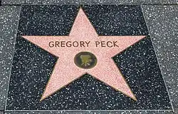 Gregory Peck's brand new star on a vibrant charcoal terrazzo pad surrounded by faded terrazzo