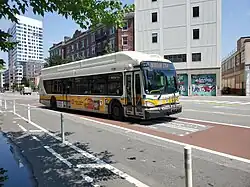 A bus on a red bus lane on an urban street