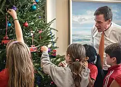 School Children help to decorate a Christmas tree, in Washington DC, United States