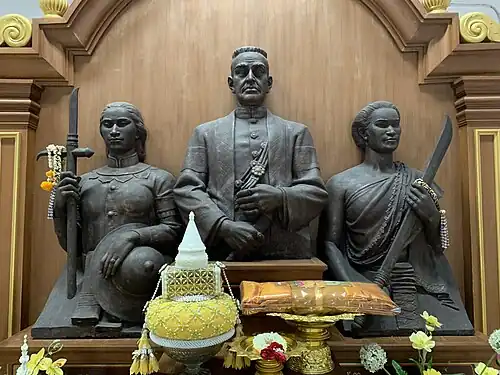 Statues at the multipurpose pavilion of Wat Mahathat Yuwaratrangsarit, Bangkok, depicting (from left to right): Princess Phikunthong, Maha Sura Singhanat, and Sri Anocha.