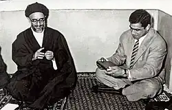 Mahmoud Taleghani gives a Quran as gift to Gholamreza Takhti in a meeting, Hedayat Mosque, Tehran - 1957