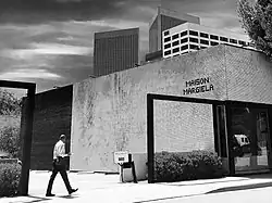 Black and white photo of storefront with the Maison Margiela name in tile lettering on facade