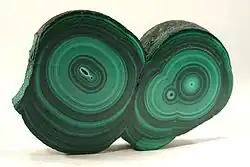 Slice through a double stalactite, from Kolwezi, Democratic Republic of the Congo. Size 5.9 × 3.9 × 0.7&nbsp;cm.