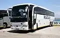 A Marcopolo Mercedes-Benz coach in MegaCoach livery at Mossel Bay Central, Mosselbaai, South Africa