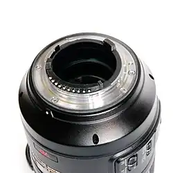 The flange of a current F-mount lens, including aperture lever (upper left) and CPU contacts (bottom).