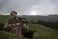 New Zealand Defence Force soldier denoting opposing force status by wearing Desert Disruptive Pattern Material (DPM) in a temperate environment.
