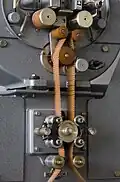 A synchronous-motor moves the paper strips across the reader.