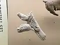 Spear thrower carved with 3 horse heads at three different ages (antler or deer bone)