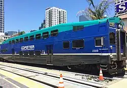 Left: A COASTER Bombardier BiLevel cab car at San Diego's Santa Fe Depot.