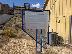 AFRICAN AMERICANS AND THE BOSTON SALOON: Between 1866 and 1875, a remarkable business thrived in Virginia City. Free-Born William A.G. Brown operated the Boston Saloon, serving Virginia City's African Americans. Archaeologists have revealed that Brown offered his customers finely prepared meals with the best cuts of meat. Shortly after Brown sold his business, the great fire of 1875 swept through town and destroyed the building. There were rarely more than one hundred African Americans living in Virginia City during its height in the 1860, but they played varied and important roles in the community. Some African Americans pursued work as laborers, porters, and barbers. Other became affluent business owners, and a prominent doctor won widespread respect. By the 1870's, African American children attended integrated schools. However, the decline of mining by 1880 sent many Nevadans, including African Americans, elsewhere. When mining in the state revived in the early 1900s, a shift at the federal, state, and local levels that implemented segregation via law or practice kept most African American families from returning to communities like Virginia City. The site of the Boston Saloon is located uphill and to the left of this location at the corner of Union and D Streets now occupied by the Bucket of Blood Saloon parking lot. STATE HISTORIC PRESERVATION OFFICE DON MCBRIDE AND THE PUCKET OF BLOOD ALOON RENO-SPARKS BRANCH OF THE NAACP, UNIT #1112 STATE HISOTRICAL MARKER N. 266